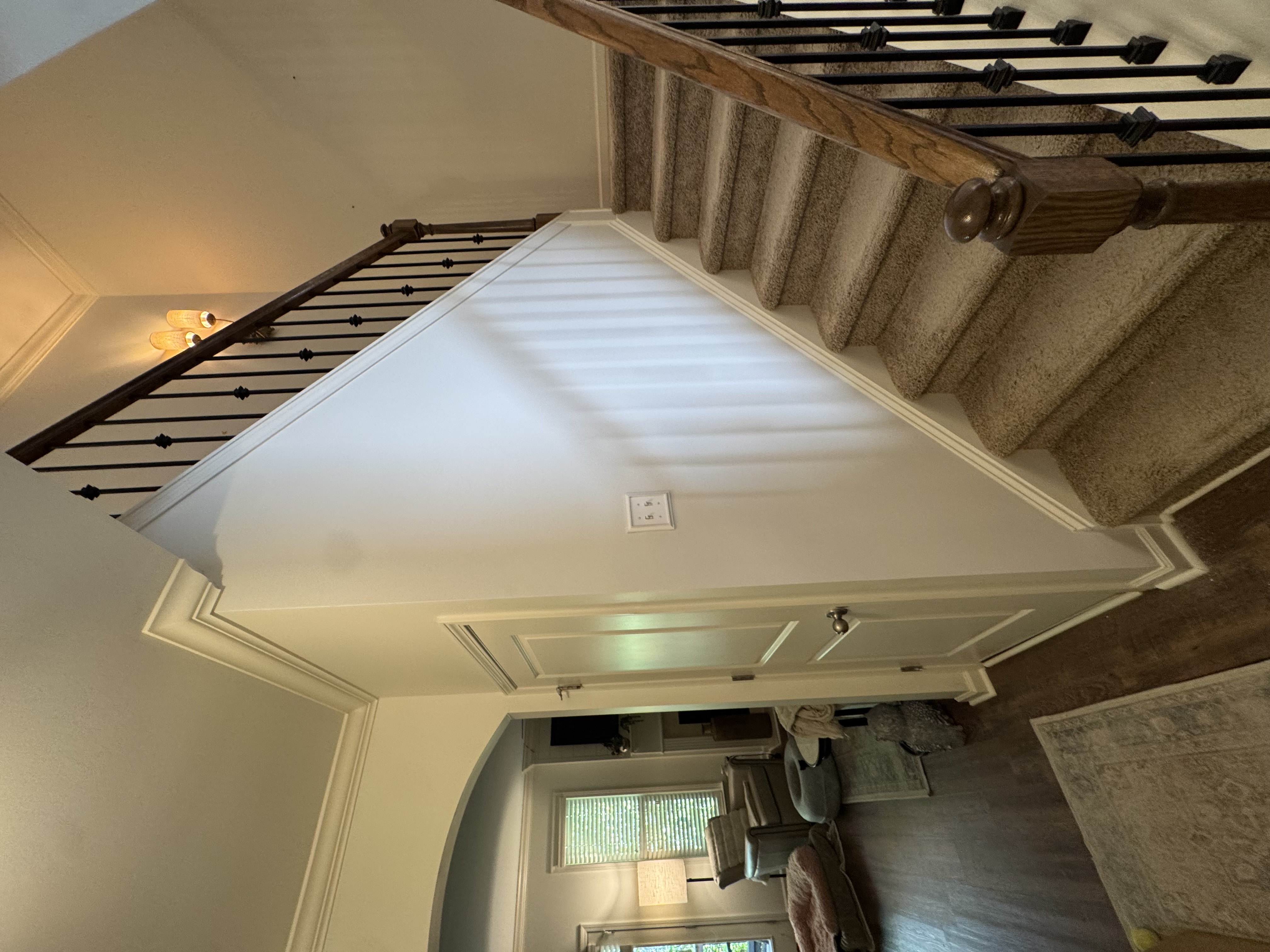Interior staircase with black iron railings